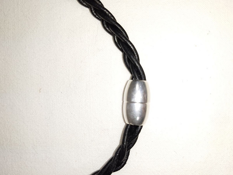 Braided leather necklace and antique silver metal pendant