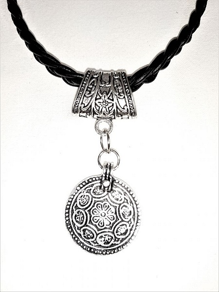 Braided leather necklace and antique silver metal pendant