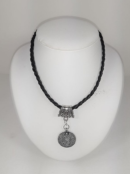 Braided leather necklace and antique silver metal pendant