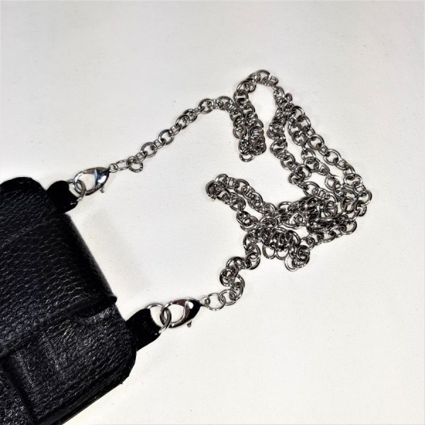 Leather smartphone pouch printed cowhide color black.